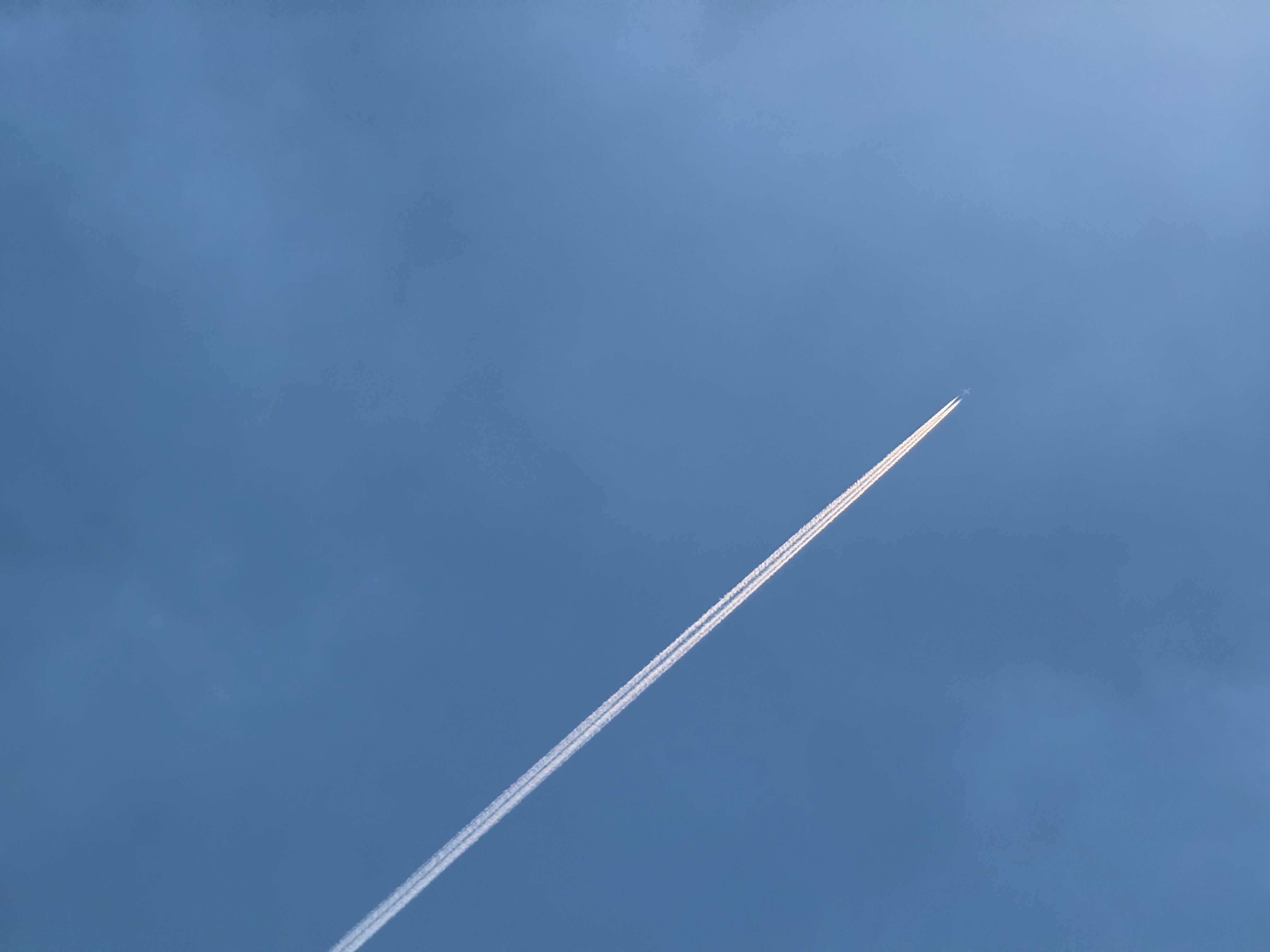 Infinity pool overlooking the sea and a hazy skyline.
